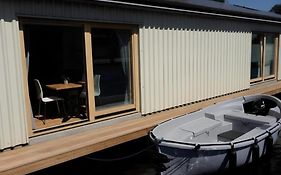 B&Boathouse Amsterdam With Bikes And Motorboat